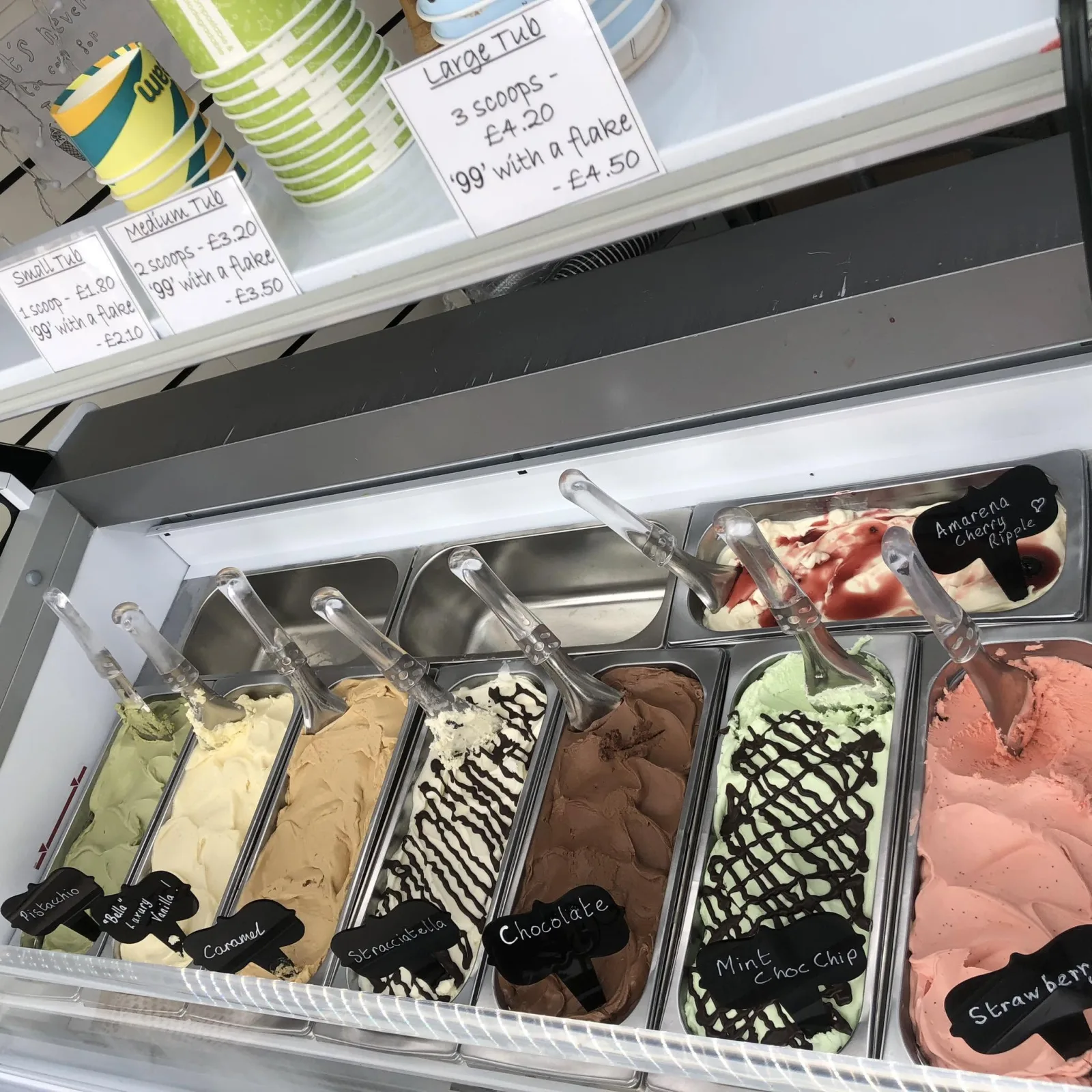 The Manfredi ice cream counter with trays of pistachio, vanilla, chocolate and strawberry gelato